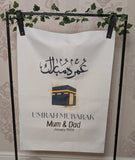 Umrah Mubarak banner with Arabic and English Text includes 8 Balloons
