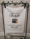 Umrah Mubarak banner with Arabic and English Text includes 8 Balloons