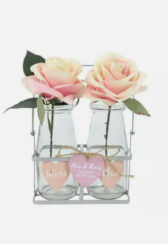 His and Hers  glass milk bottles in a wire display rack